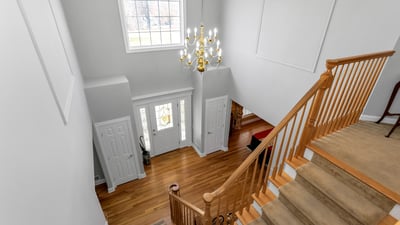 Gleaming hardwood flooring, custom moldings, display shelves, and natural light.
