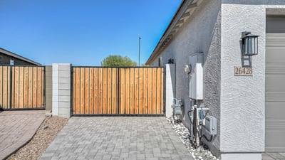 This custom RV gate provides secure and convenient side-yard access for recreational vehicles or trailers. Complete with paver stone drive and clean modern fencing, it's a standout feature for flexibility and function in Peoria living.