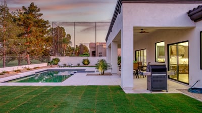 Covered patios, a sparkling pool, and golf course views create the perfect setting for outdoor living in Scottsdale.