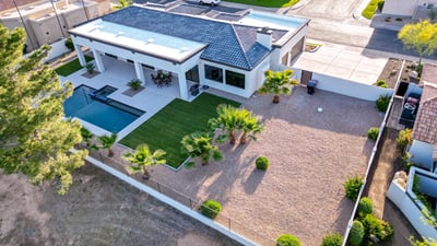 A wide lot with pool, covered patio, and low-maintenance landscaping offers the perfect Scottsdale outdoor retreat.