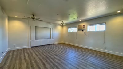 Expansive upstairs room ideal for media, office, or fitness space. Recessed lighting and clean finishes enhance its versatility.