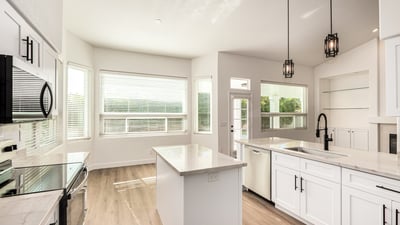 Bright Scottsdale dining area adjacent to the updated kitchen with large windows and views of the backyard. The open layout and modern finishes create an inviting environment for meals and gatherings.