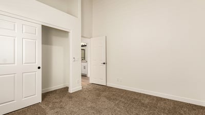 Additional bedroom with natural light, plush carpet, and neutral tones. The flexible Scottsdale space works well as a guest room, office, or additional living area.