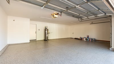 Expansive three-car garage offering plenty of room for vehicles, storage solutions, and workspace. The Scottsdale garage features a clean finished floor and direct access to the home for everyday convenience.