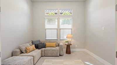 Adaptable flex room with tile floors and neutral tones, easily suited for a home office, workout room, or creative studio.