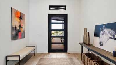 Bright interior entry featuring clean lines, neutral tones, and modern architectural details. This Scottsdale home offers a polished first impression with functional flow.