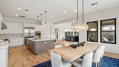 Great room featuring large sliding doors that open to the patio, blending indoor and outdoor living. Ideal for enjoying Scottsdale s climate and entertaining guests.