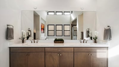 Contemporary primary bathroom with dual vanities, sleek hardware, and ample counter space. Designed for everyday luxury living in Scottsdale.