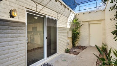 Quiet courtyard patio providing a private outdoor escape with low-maintenance design and indoor-outdoor flow.