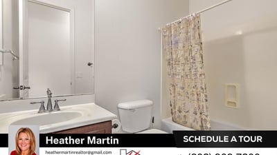 This clean and functional guest bathroom includes a full tub and shower, extended vanity, and wood cabinetry. A practical addition to this well-maintained Glendale home for sale.