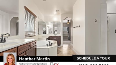 Unwind in the oversized soaking tub surrounded by extended counter space and dual sinks. A spa-like feature within this Glendale property offering modern updates and energy-efficient living.