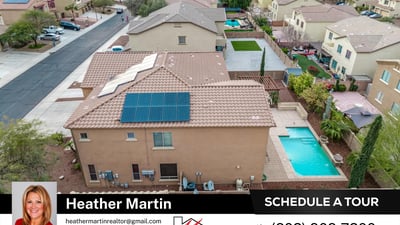 Top-down view showcases the extensive solar panel installation for energy efficiency. The tile roof and pool area enhance this Glendale home s overall appeal.