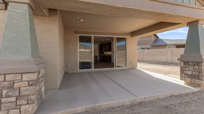 Covered patio designed for comfort and shade, perfect for outdoor seating, grilling, or relaxing evenings.