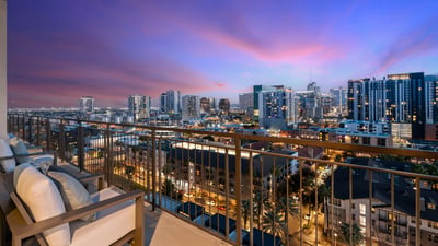 Inviting balcony space with seating and sweeping city views, ideal for relaxing and enjoying the Phoenix skyline.