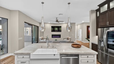 Large island with seating and pendant lighting, perfect for gatherings and daily living in this updated Scottsdale kitchen.