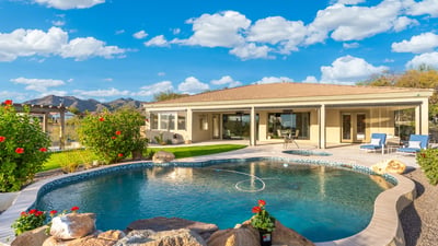 Scottsdale backyard with pool, spa, and covered patio overlooking scenic mountain views, perfect for outdoor entertaining.