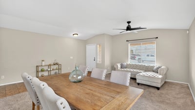 Flexible dining and living area with neutral tones and natural light. Open-concept layout enhances everyday living and entertaining in this Casa Grande home.