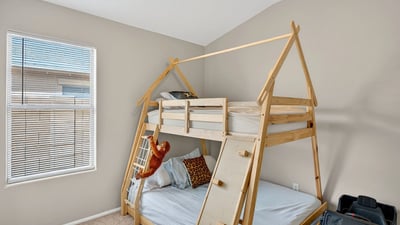 Cozy bedroom with neutral tones and natural light. Perfect for relaxation or guest use in this Casa Grande home.