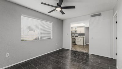 Bright and open room with updated flooring and natural light. This Sun City home offers versatile space to fit your lifestyle needs.