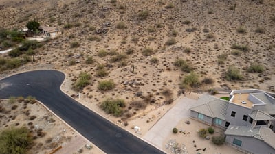 Quiet cul-de-sac homesite positioned against scenic desert mountains in Phoenix. This elevated lot offers privacy, natural beauty, and excellent potential for a luxury custom home retreat.