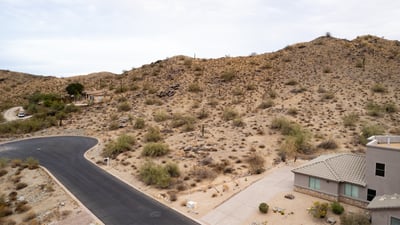 Expansive desert hillside lot offering panoramic mountain scenery and surrounding luxury homes. Located in Phoenix, this elevated property provides the ideal setting for a private custom retreat.