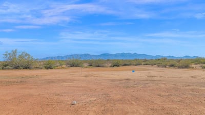 Picturesque mountain vistas stretch across the horizon, creating a beautiful backdrop for this Wittmann property. The expansive lot allows homeowners to enjoy the tranquility and openness of desert living.