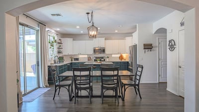 Open dining space that flows effortlessly into the updated kitchen and overlooks the backyard patio. Designed for easy entertaining and comfortable family gatherings.