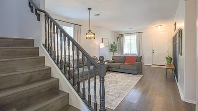 Gorgeous kitchen with quartz countertops, stainless steel appliances, expansive island seating, and an open-concept design perfect for entertaining and everyday family life.