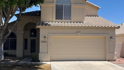 Beautifully maintained exterior with attractive architecture, mature shade trees, a covered front entry, and an attached 2-car garage in the sought-after Val Vista Lakes community in Gilbert.