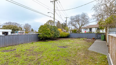 Spacious, fenced yard with potential for landscaping or outdoor activities, conveniently located near amenities and transport.