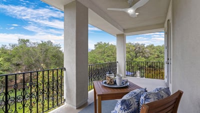 Primary Bedroom Private and Spacious balcony with scenic views, perfect for outdoor relaxation and enjoying nature's beauty.