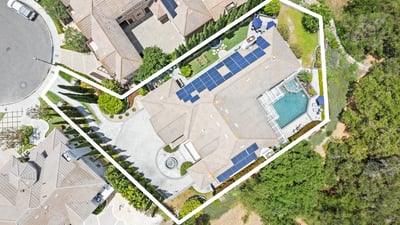 Spacious property featuring a solar-equipped home, pool, and landscaped outdoor areas in a private location.