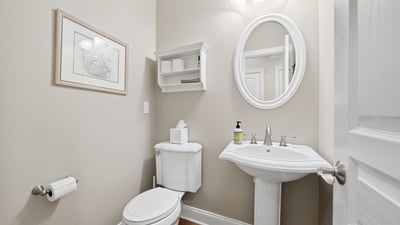 Bright and functional half bath featuring modern fixtures and a clean, inviting atmosphere.