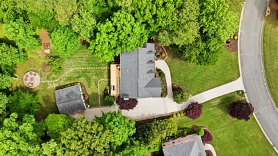 Nestled in lush greenery, this property features spacious outdoor areas and a thoughtfully designed layout.