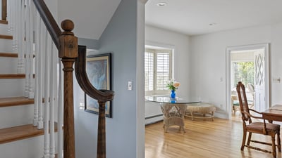 Welcoming foyer leads to an airy dining area, featuring natural light and quality craftsmanship throughout.