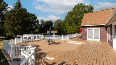 Spacious outdoor deck with a pool, perfect for entertaining and enjoying warm summer days.