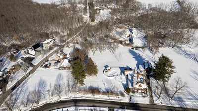 Expansive winter landscape featuring spacious lots and scenic views, perfect for your dream home development.
