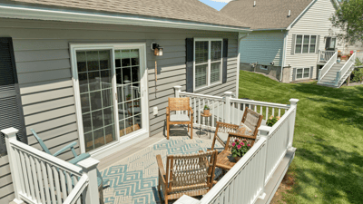 Bright outdoor space featuring welcoming seating and attractive landscaping, perfect for relaxation and gatherings.