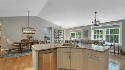 Bright and open living space featuring a modern kitchen seamlessly connected to the inviting dining area.