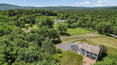 Spacious home nestled in lush greenery, offering panoramic views and ample outdoor space for relaxation.