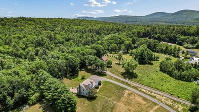 Expansive property with sprawling landscapes and mountain views, perfect for outdoor enthusiasts and peaceful living.