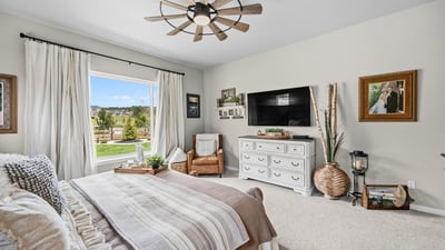 Primary Suite with attached 5 piece bath and walk in closet.