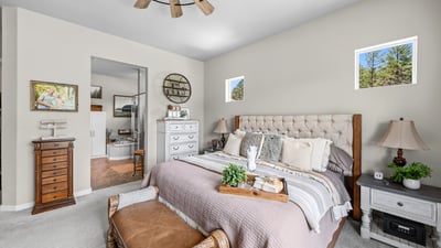 Primary Suite with attached 5 piece bath and walk in closet.