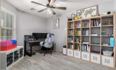 Bright and versatile, this bonus room offers endless possibilities as a home office, study area, craft room, or playroom. Updated flooring, ceiling fan, and natural light create a comfortable workspace.