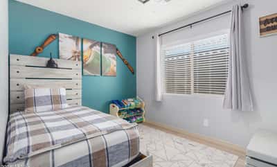 This bright bedroom features abundant natural light, updated flooring, and versatile space that's ideal for guests, a home office, hobby room, or growing household needs.