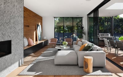 Modern living room featuring sleek design, ample natural light, and seamless indoor-outdoor flow perfect for entertaining.