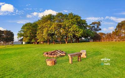 Expansive outdoor space featuring a cozy fire pit area, perfect for gatherings and relaxation.