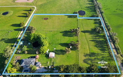 Expansive property featuring lush pastures and water features, perfect for agricultural pursuits or private retreat.