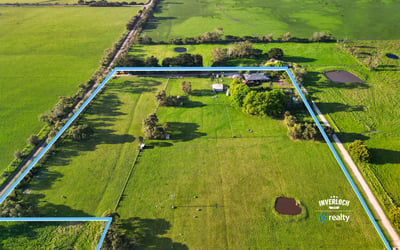 Spacious rural property featuring vast grassy fields, multiple water features, and expansive potential for development.