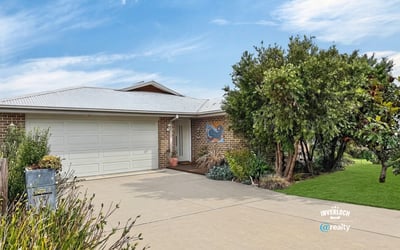 Spacious home featuring a low-maintenance yard and ample driveway parking, perfect for families or investors.